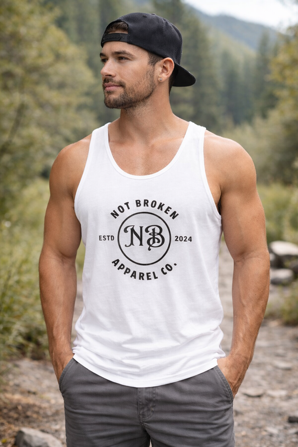 Athletic man wearing the Not Broken classic black tank top, essential outdoor gear for the resilient veteran.